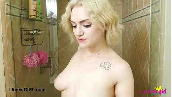 Stunning blonde beauty enjoys a sensual bath